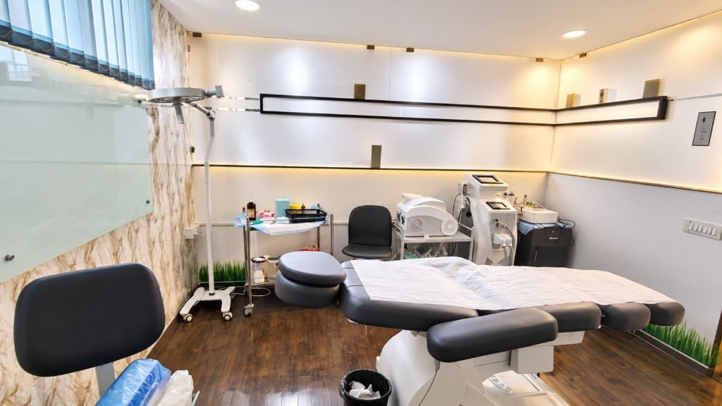 State-of-the-art clinical treatment suite at Crown Celebrity Aesthetic with advanced laser consoles and treatment bed