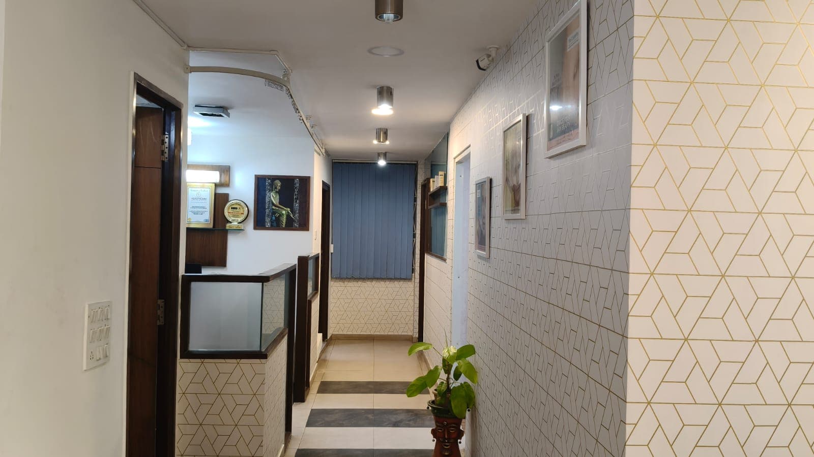 Reception hallway at Crown Celebrity Aesthetic with certificates and treatment rooms